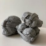 Heads, stone sculpture, part of Homage to "Pictorial content" by Rene Magritte Diptych-ראשים